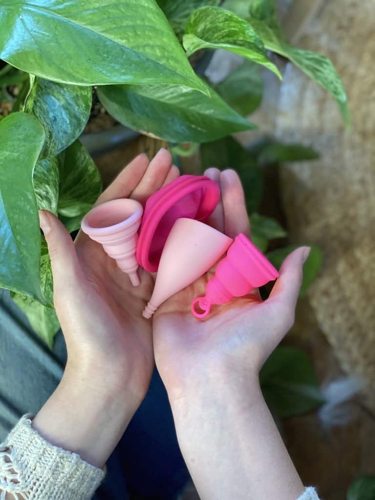 hands holding the best menstrual cups for beginners