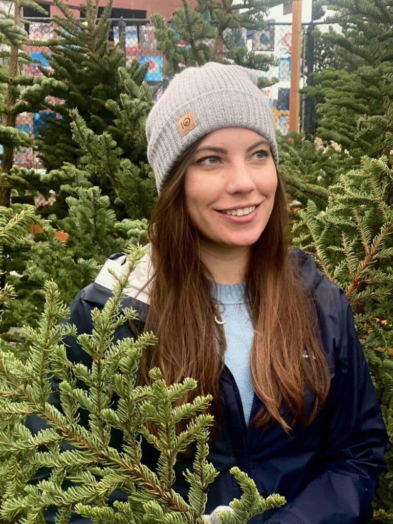 A woman in a Christmas tree farm while on her screen detox.